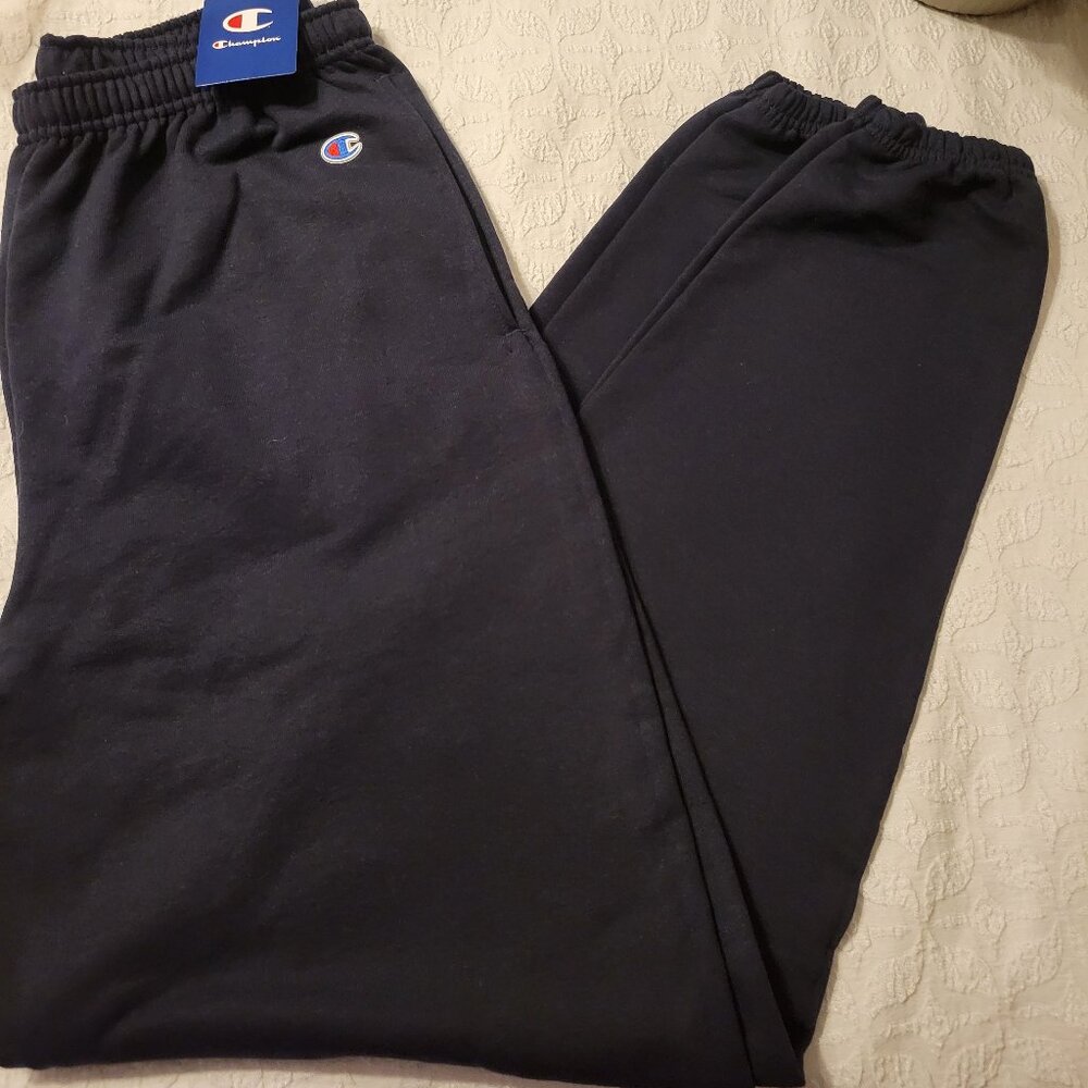 NWT Dark Blue Champion Sweatpants with pockets and elastic at hem.